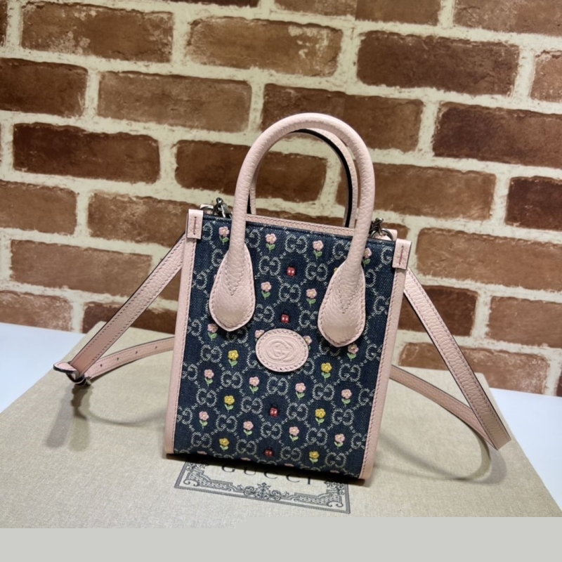 G*u*i top handle bags